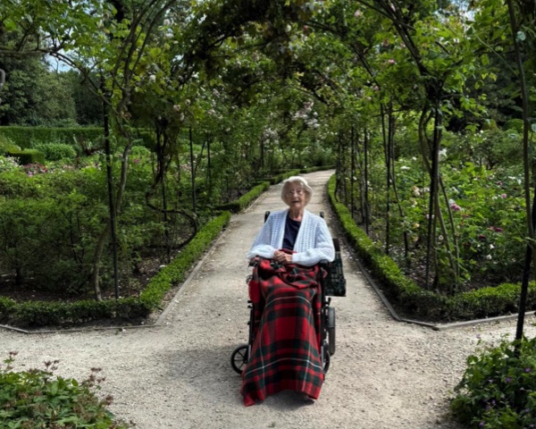 Lady in wheelchair in lovely garden